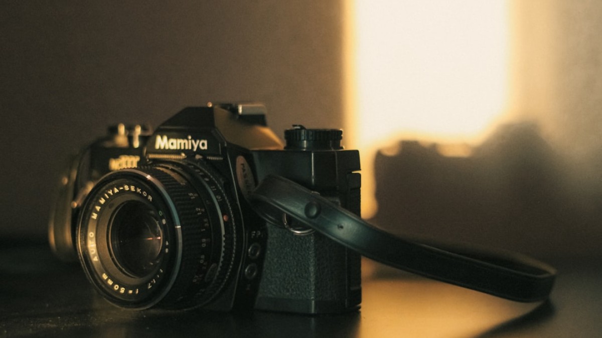 a camera sitting on top of a wooden table