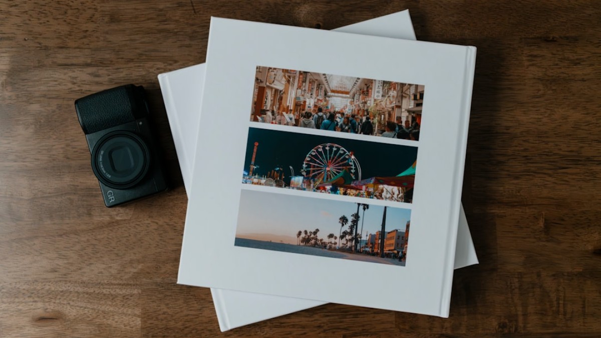 A couple of photos sitting on top of a wooden table