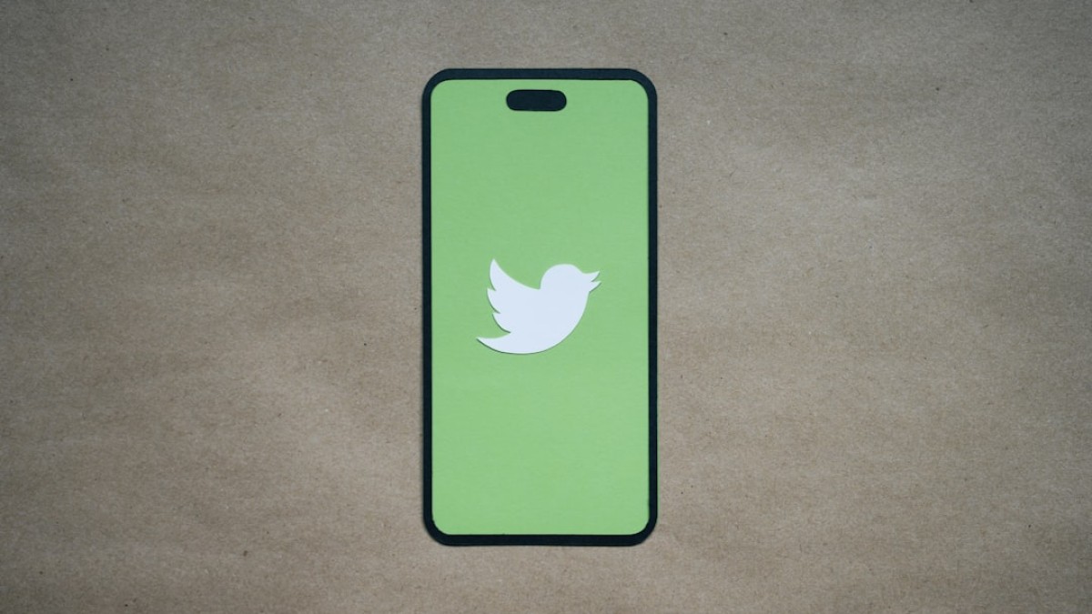 a green phone case with a white bird on it