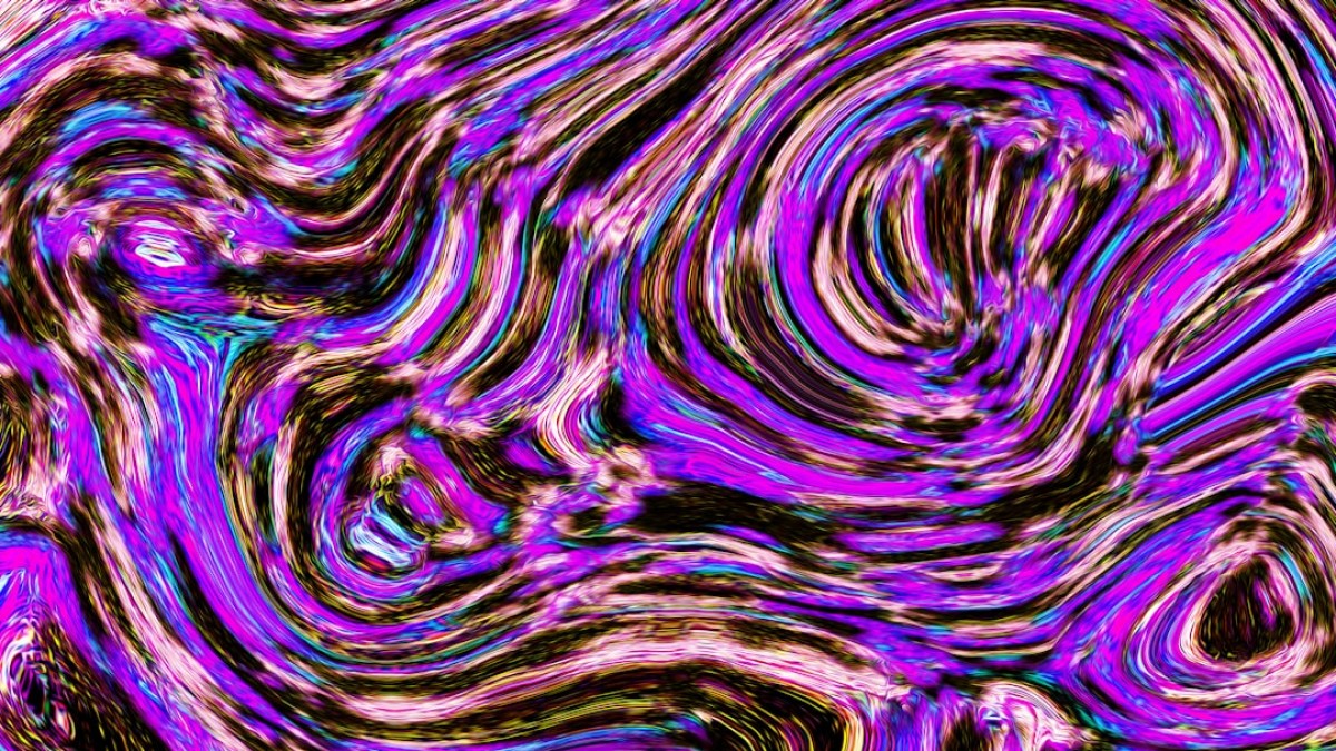 Abstract swirls of purple, pink, and black.