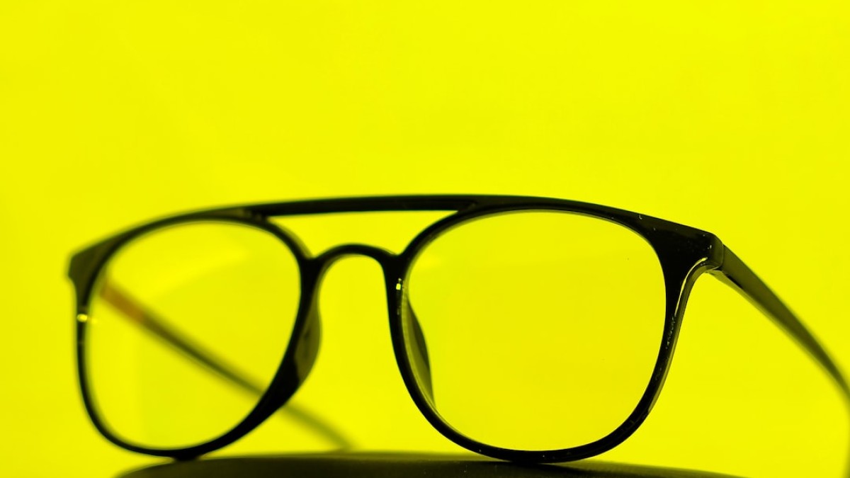 a pair of glasses sitting on top of a table