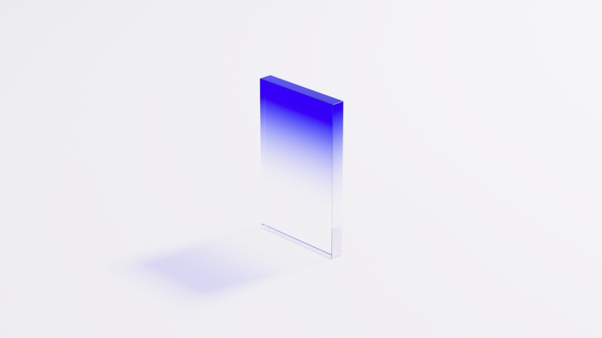 a blue and white square shaped object on a white surface