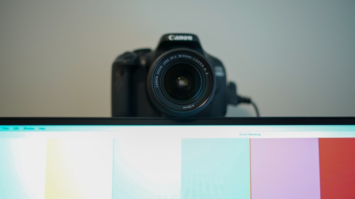 black nikon dslr camera on white table