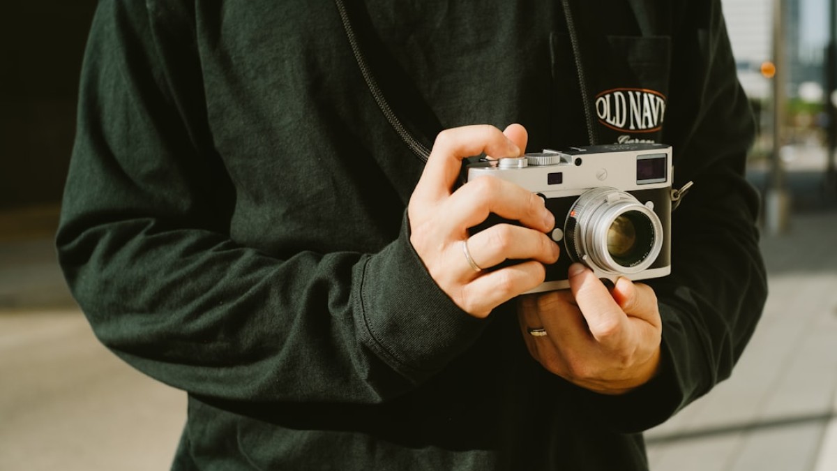A man holding a camera in his hands