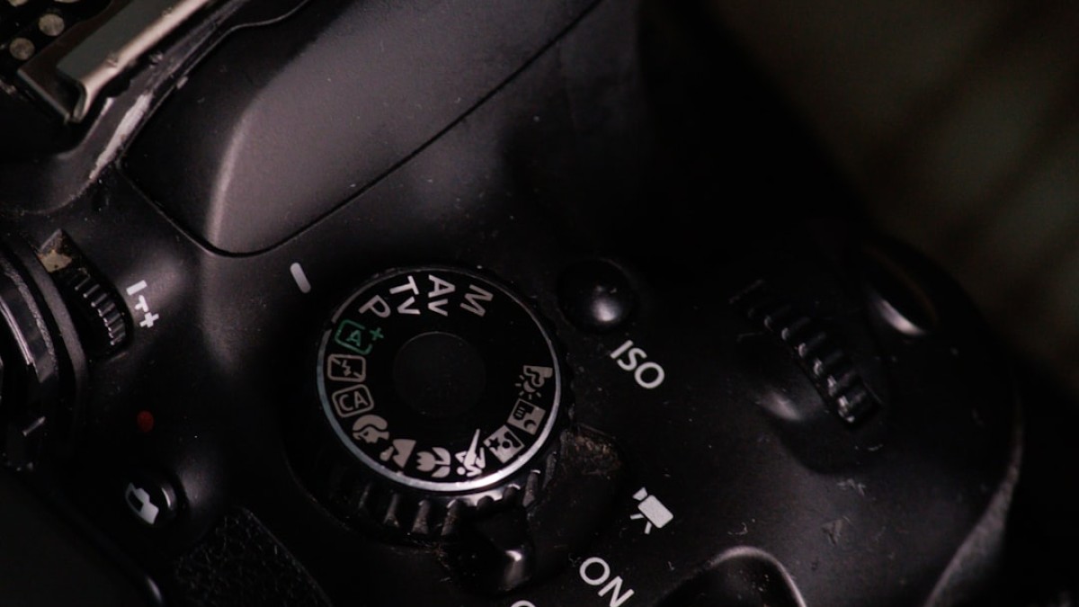 A close up of a camera with a black background