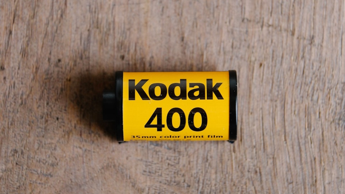 a close up of a battery on a wooden surface