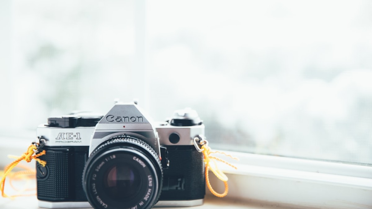 Canon SLR camera on window