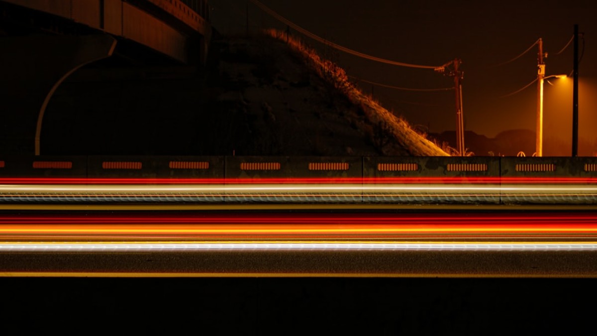 A blurry photo of a bridge at night